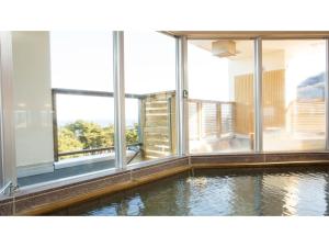 a pool of water in a room with windows at Hotel Keipu - Vacation STAY 11139v in Hakodate