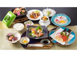 a table with plates of food and bowls of food at Hotel Keipu - Vacation STAY 11139v in Hakodate