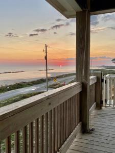 a porch of a house with a view of the beach at OceanFront home near HollyBeach in Cameron