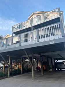 a house with a deck on top of it at Endless Summer Beach House in Myrtle Beach