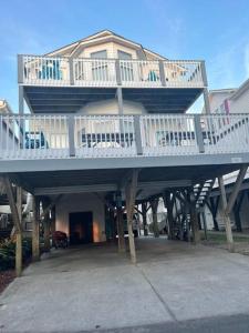 a large house with a deck on top of it at Endless Summer Beach House in Myrtle Beach