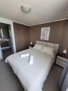 Posteľ alebo postele v izbe v ubytovaní Disfruta Depto. Antofagasta 2