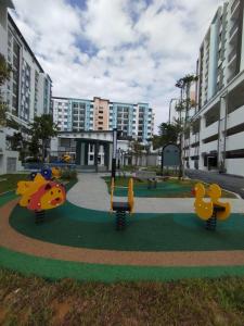 a playground with two rubber ducks in a park at Bayu Temiang- Your Urban Retreat in Seremban