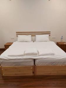 Postel nebo postele na pokoji v ubytování Oi Beach
