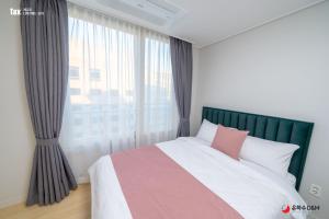 Katil atau katil-katil dalam bilik di Eunhasu D&M Residence Haetsal 1
