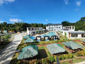an aerial view of a resort with a swimming pool at JADE RESORT - Bauang, La Union in Bauang