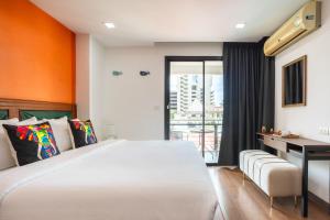 Postel nebo postele na pokoji v ubytování Citismart Luxury Apartments + 37 fotografií