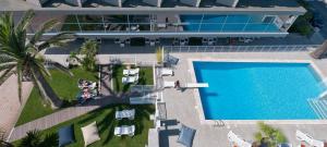an overhead view of a swimming pool at a resort at Hotel Eden in Alba Adriatica
