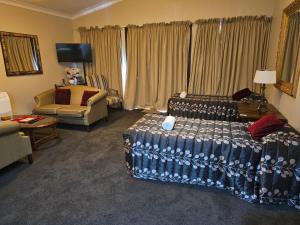 Voodi või voodid majutusasutuse Gateway Motor Inn toas