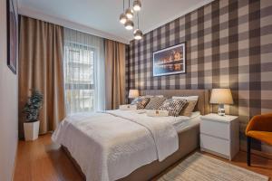 Postel nebo postele na pokoji v ubytování Rio de Mare - Nadmorze Apartments