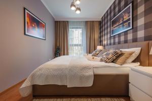 Postel nebo postele na pokoji v ubytování Rio de Mare - Nadmorze Apartments