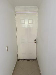 a white door in a room with a white wall at Apartamento Ciudad Salitre Bogota - Amoblado in Bogotá