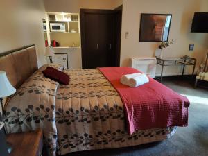 Voodi või voodid majutusasutuse Gateway Motor Inn toas