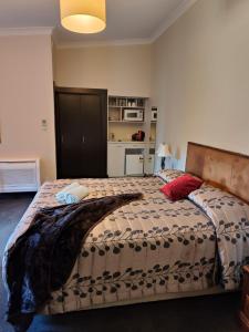 Voodi või voodid majutusasutuse Gateway Motor Inn toas