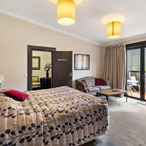 Voodi või voodid majutusasutuse Gateway Motor Inn toas