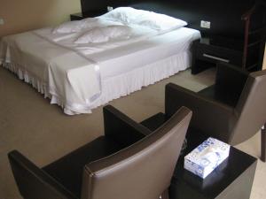 A bed or beds in a room at Hotel Delpack