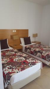 Cama o camas de una habitación en Hospedaria Flor do Guadiana