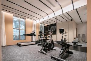 a gym with treadmills and cardio equipment in a building at Atour Hotel Shanghai Lujiazui Pudong Avenue in Shanghai