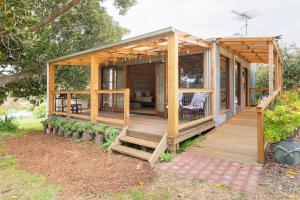 a wooden house with a porch and a deck at It's Bonza! at Mill About Vineyard in Williamstown