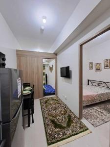 a room with a bedroom with a bed and a mirror at Azul Condo 2 bedroom Manila in Manila
