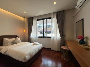 Katil atau katil-katil dalam bilik di Bunya House near BTS Asok, Terminal21 Free BF
