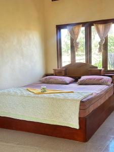 Postel nebo postele na pokoji v ubytování Happy bangalow
