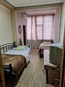 Postel nebo postele na pokoji v ubytování GUEST HAUSE & HOSTEL 15a