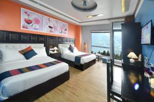 Postel nebo postele na pokoji v ubytování Sapa Nature View Hotel