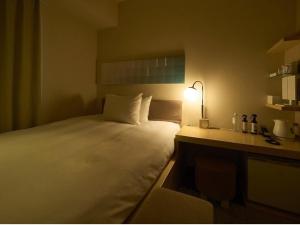 Postel nebo postele na pokoji v ubytování Hotel Resol Ikebukuro