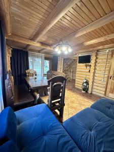 a living room with a couch and a table at Oberig Apartmens in Vorokhta