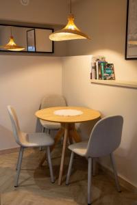 a table and four chairs in a room at Barbara 76 in Ustroń