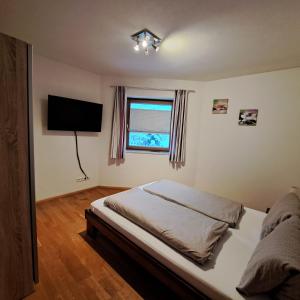 Krevet ili kreveti u jedinici u okviru objekta Ferienwohnung Prama