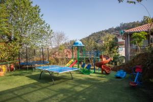 a playground with many different types of play equipment at Hotel Sarathi in Dhulikhel