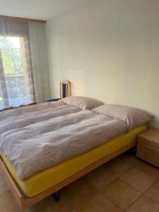 Postel nebo postele na pokoji v ubytování Résidence Castel Club Leysin Parc