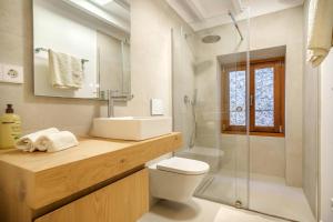 a bathroom with a sink and a toilet and a shower at VALL PETIT in Valldemossa +16 photos