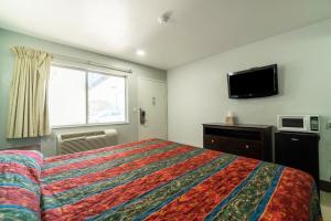 Voodi või voodid majutusasutuse Xpress Inn & Extended Stay toas