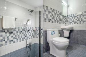 y baño con aseo y ducha. en FabHotel Abrigo Residency en Munnar