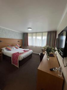 TV a/nebo společenská místnost v ubytování Hermitage Park Hotel