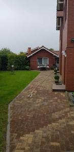a brick walkway in front of a house at Ferienhaus Anna in Neuendorf