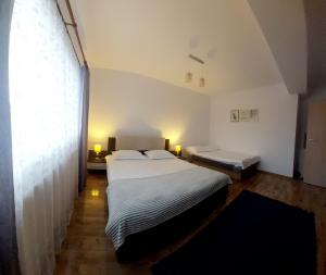 Katil atau katil-katil dalam bilik di DAS home-Apartament cu vedere la munte