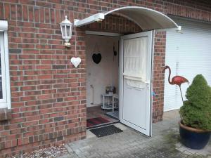 an entrance to a brick house with an open door at Ferienhaus "Martha" in Berndshof