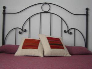 
Una cama o camas en una habitación de Hostal Las Tinajas de Cachi
