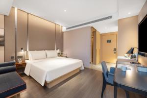 Ένα ή περισσότερα κρεβάτια σε δωμάτιο στο Atour Hotel Xi'an Chanba Exhibition Center Expo Park