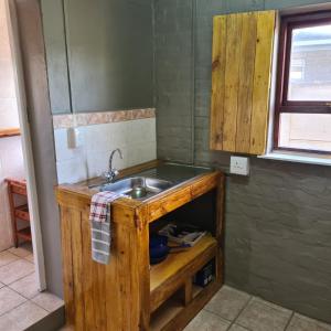 a kitchen with a sink and a counter at Mads Place in Cape Town +11 photos