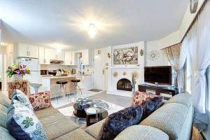 a living room with a couch and a fireplace at 1Vancouver guest house in Vancouver