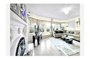 a living room with a couch and a table at 1Vancouver guest house in Vancouver