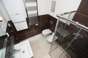Koupelna v ubytování Apartments Karlin