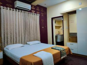 Fotografie z fotogalerie ubytování ISHA Residency v destinaci Ernakulam + 8 fotografií