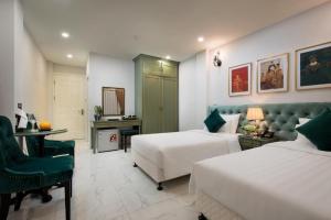 Ліжко або ліжка в номері Gatsby Central Hotel Hanoi