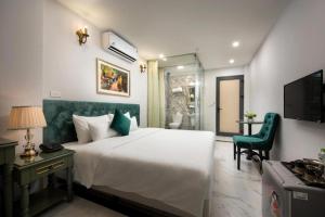 Ліжко або ліжка в номері Gatsby Central Hotel Hanoi
